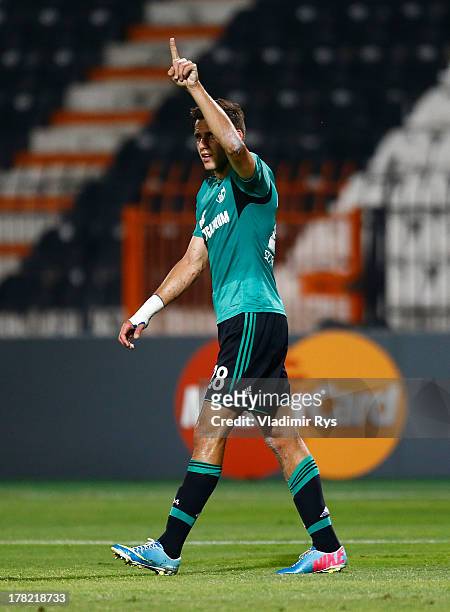 Adam Szalai of Schalke celebrates after scoring his team's first goal during the UEFA Champions League second leg play-off match between PAOK...