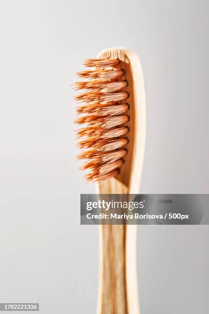 close-up of hairbrush against white background - dentifrice stockfoto's en -beelden