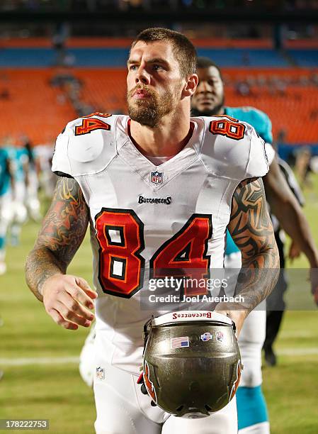 Tom Crabtree of the Tampa Bay Buccaneers exits the field after the preseason game against the Miami Dolphins on August 24, 2013 at Sun Life Stadium...