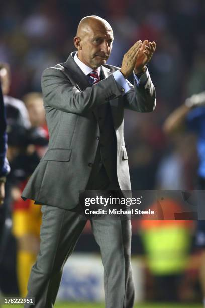 Ian Holloway the manager of Crystal Palace applauds the home supporters after his sides1-2 defeat during the Capital One Cup second round match...