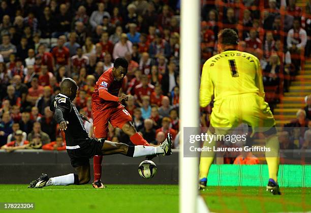 Daniel Sturridge of Liverpool scores the third goal past keeper Bartosz Bialkowski of Notts County during the Capital One Cup Second Round between...