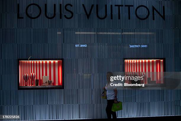 Shoppers leave a Louis Vuitton store at the Village Mall shopping News  Photo - Getty Images