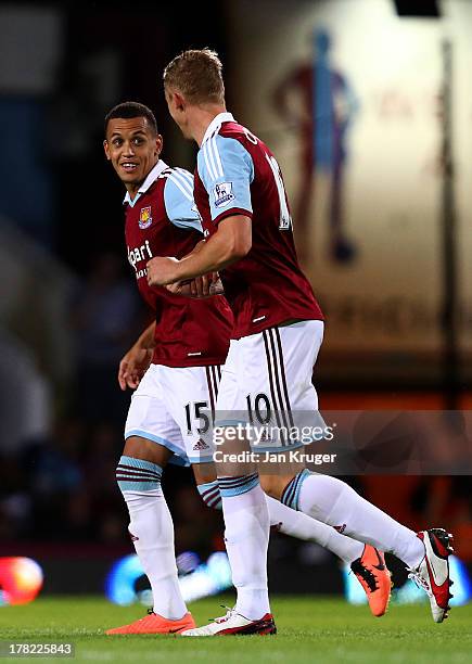 Ravel Morrison of West Ham United celebrates with team-mate Jack Collison after scoring their second goal during the Capital One Cup second round...