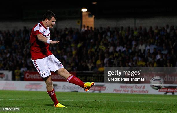 John Arne Riise of Fulham scores the winning goal in the penalty shoot-out during the Capital One Cup Second Round match between Burton Albion and...