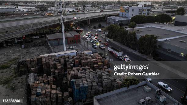 Los Angeles, CA, Monday, November 13, 2023 - A line of cars crawls along Long Beach Ave., past a pallet yard located a few blocks from the site of a...