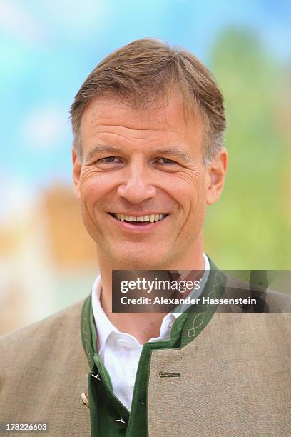 Jannik Inselkammer, CEO of Augustiner Braeu attends the official 2013 Oktoberfest one-liter beer glass presentation three weeks ahead of Oktoberfest...