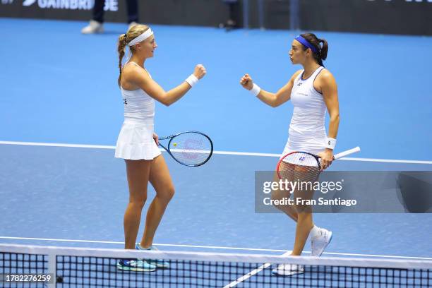 Caroline Garcia and Kristina Mladenovic of Team France celebrate after winning the Billie Jean King Cup Finals group stage doubles match between...