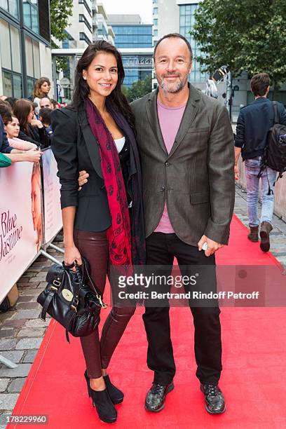 Alex Denis , manager of Paris' famed restaurant "L'Avenue" and his wife actress Catalina Denis arrive to the Paris premiere of "Blue Jasmine" at UGC...