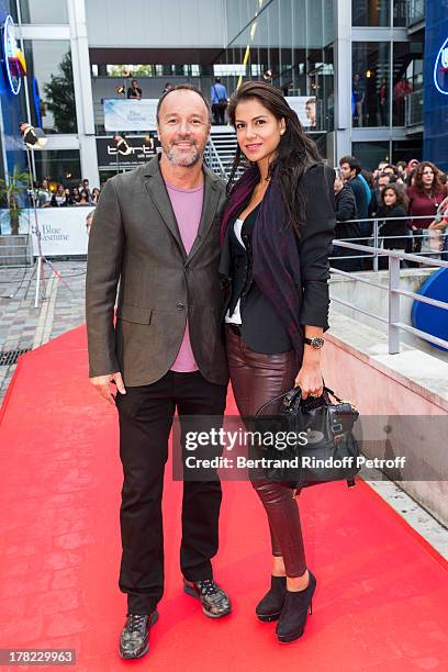 Alex Denis , manager of Paris' famed restaurant "L'Avenue" and his wife actress Catalina Denis arrive to the Paris premiere of "Blue Jasmine" at UGC...