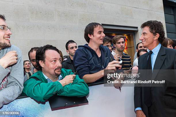 Former French Culture Minister Jack Lang meets with fans as he arrives to the Paris premiere of "Blue Jasmine" at UGC Cine Cite Bercy on August 27,...