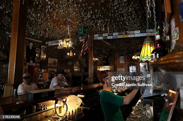 Local residents have drinks at the Iron Door Saloon, the oldest continuously operating saloon in California and a popular tourist destination, on...