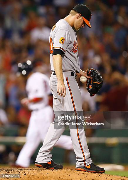 Troy Patton of the Baltimore Orioles reacts after giving up a three-run home run by Shane Victorino of the Boston Red Sox in the fifth inning during...