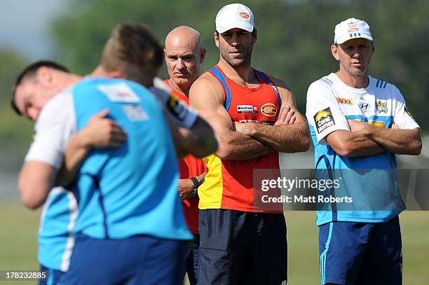 Suns assistant coach, Dean Solomon and Titans assistant coach Steve Murphy look on during a Gold Coast Titans training session at Metricon Stadium on...