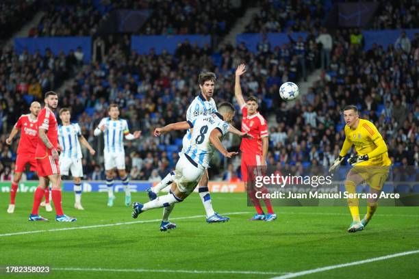Mikel Merino of Real Sociedad scores the team's first goal during the UEFA Champions League match between Real Sociedad and SL Benfica at Reale Arena...
