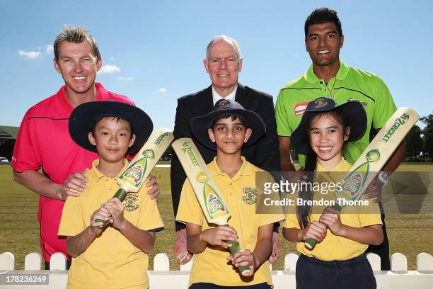Brett Lee, Greg Chappell and Gurinder Sandhu pose with school children during a Cricket Australia media announcement at Blacktown Sportspark on...