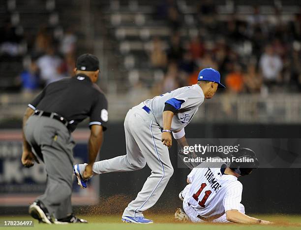 Alcides Escobar of the Kansas City Royals catches Clete Thomas of the Minnesota Twins stealing second base during the eighth inning of the game on...