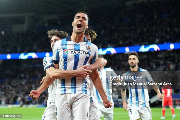 Mikel Merino of Real Sociedad celebrates with teammates after scoring the team's first goal during the UEFA Champions League match between Real...
