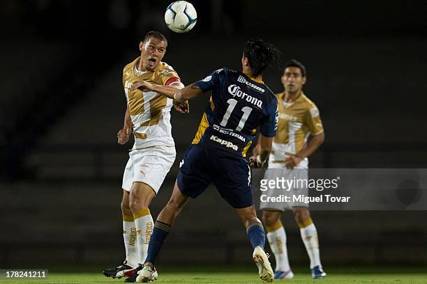 Dario Veron of Pumas fights for the ball with Alejandro Castillo of Atletico San Luis during a match between Pumas and Atletico San Luis as part of...