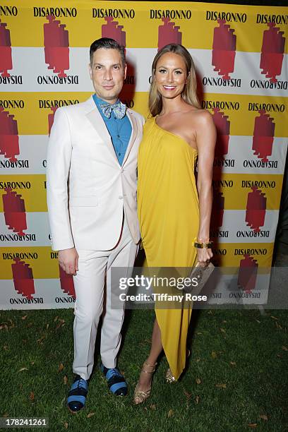 Host Cameron Silver and Stacy Keibler attend the Disaronno Sunset Screening of "Roman Holiday" on August 22, 2013 in Los Angeles, California.