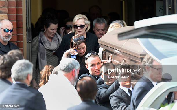 Family members of Australian baseball player Chris Lane, who was killed in the small Oklahoma town of Duncan, follow as his coffin is carried out of...