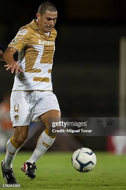 Dario Veron of Pumas drives the ball during a match between Pumas and Atletico San Luis as part of the Apertura 2013 Copa MX at Olympic Stadium on...