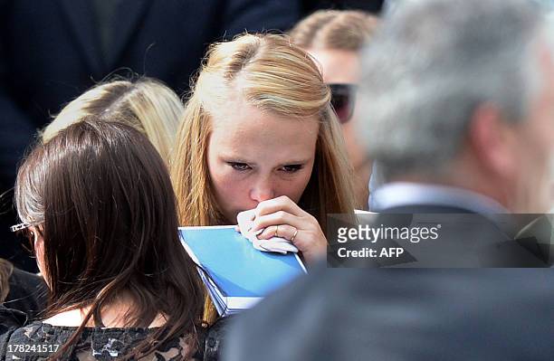 Girlfriend Sarah Harper mourns with family members of Australian baseball player Chris Lane, who was killed in the small Oklahoma town of Duncan in...