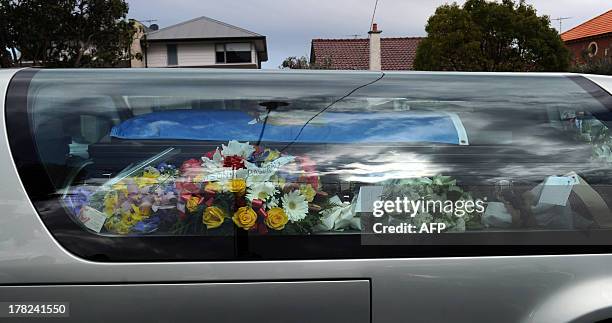 The coffin of Australian baseball player Chris Lane, who was killed in the small Oklahoma town of Duncan in the US, leaves St Therese's Parish...