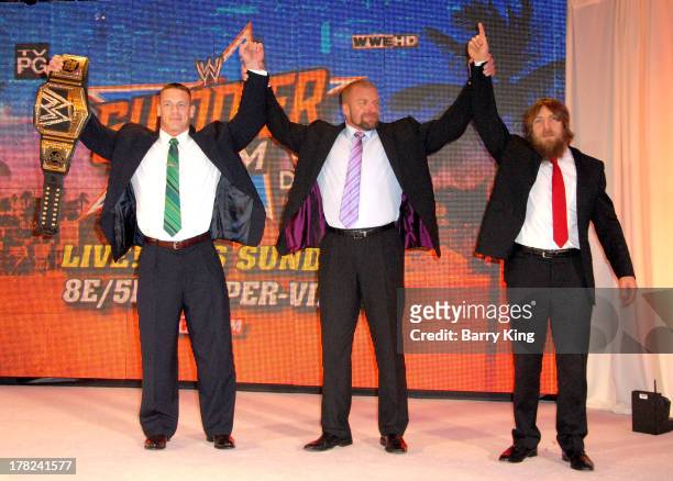 Superstars John Cena, Triple H and Daniel Bryan pose at the WWE SummerSlam Press Conference on August 13, 2013 at the Beverly Hills Hotel in Beverly...