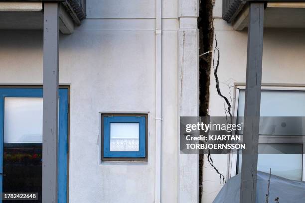 This photo taken on November 13, 2023 shows a crack cutting through the facade of a house in Grindavik, southwestern Iceland, following earthquakes....