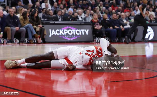 Toronto Raptors guard Dennis Schroder lies in pain after falling as the Toronto Raptors after being down more than 20 points come back to beat the...