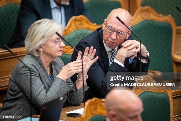 Pia Kjaersgaard and Alex Ahrendtsen of the Danish People's Party attend a debate on a bill to ban Koran burnings, in the Danish Parliament...