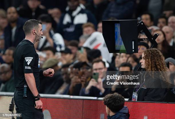 Referee Michael Oliver watches the VAR screen during the Premier League match between Tottenham Hotspur and Chelsea FC at Tottenham Hotspur Stadium...