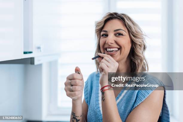 woman excited about smoking a joint - inhalation stock pictures, royalty-free photos & images