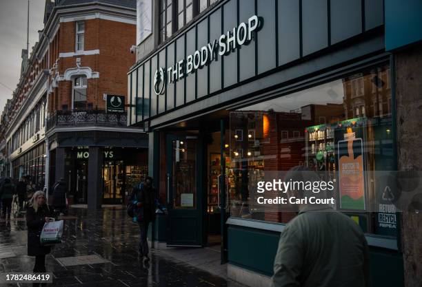 People pass a branch of The Body Shop on November 14, 2023 in London, England. Natura and Co is selling the Body Shop chain of stores to private...