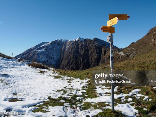mount gridone or limidario, seen from monti di ronco, switzerland - trail marker stock pictures, royalty-free photos & images