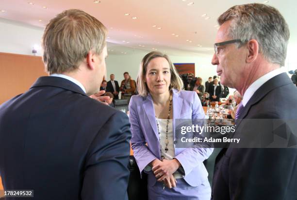 German Health Minister Daniel Bahr, German Family Minister Kristina Schroeder, and German Defense Minister Thomas de Maiziere arrive for the weekly...