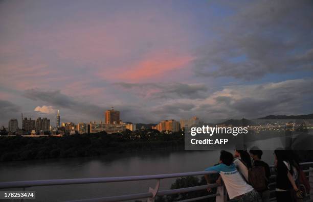 General view of Taipei at sunset on August 28, 2013. Taiwan put tens of thousands of troops on standby and shut schools and offices in an offshore...