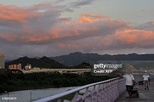 General view of Taipei at sunset on August 28, 2013. Taiwan put tens of thousands of troops on standby and shut schools and offices in an offshore...