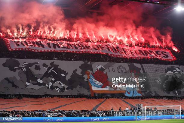 Fans of FC Copenhagen set off flares during the UEFA Champions League match between F.C. Copenhagen and Manchester United at Parken Stadium on...