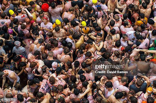 Revellers throw tomatoes while participating the annual Tomatina festival on August 28, 2013 in Bunol, Spain. An estimated 20,000 people threw 130...