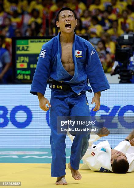 Masashi Ebinuma of Japan screams in celebration after throwing Azamat Mukanov of Kazakstan for ippon to win the u66kgs gold medal during day 2 of the...