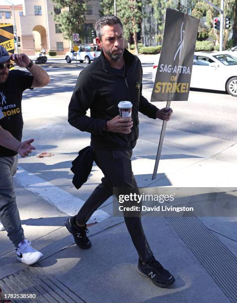 Zachary Levi joins the picket line outside Warner Bros. Studios on November 08, 2023 in Burbank, California. SAG-AFTRA has been on strike since July...