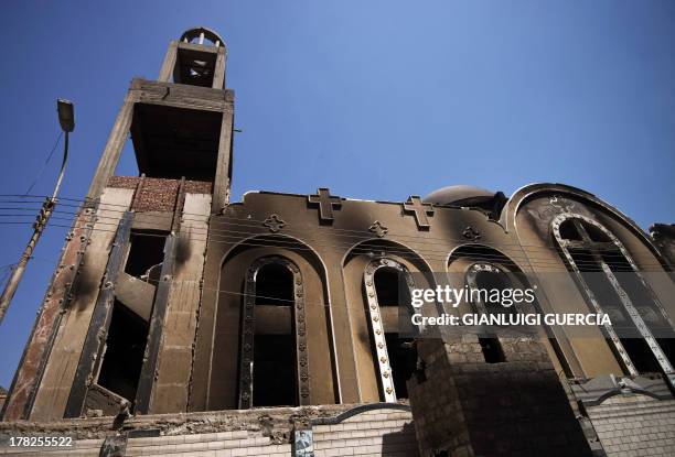 Picture taken on August 27, 2013 shows a facade of Amba Moussa Coptic church that was torched by unknown assailants in the central Egyptian city of...