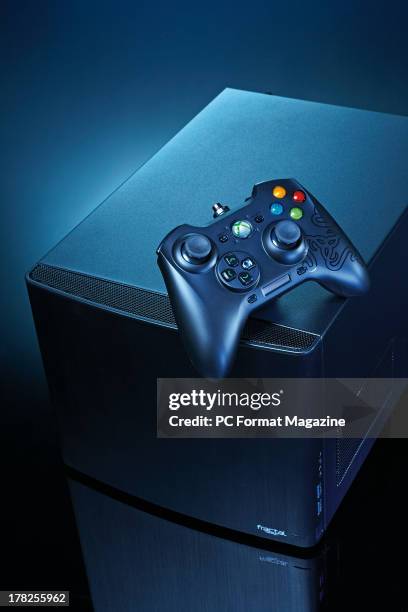 Fractal Design Node 304 PC chassis with a Razer Sabertooth Elite games controller photographed on a black background, taken on January 16, 2013.