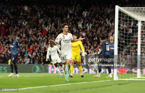 Brahim Diaz of Real Madrid celebrates after scoring the team's first goal during the UEFA Champions League match between Real Madrid and SC Braga at...