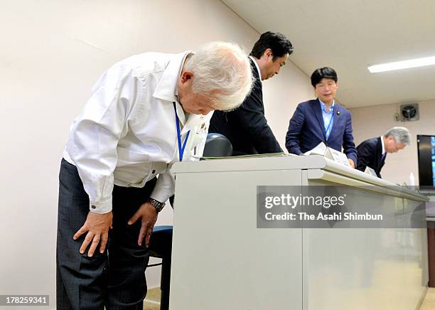 Japan Aerospace Exploration Agency President Naoki Okumura bows at a press conference after failing their Epsilon Vehicle launch at the JAXA...