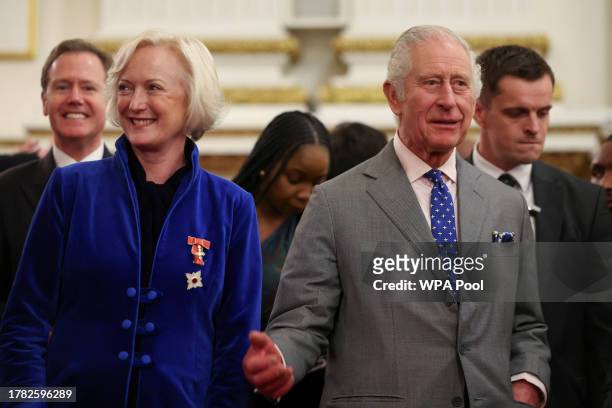 Chief Nursing Officer for England Ruth May stands next to Britain's King Charles III as they listen to NHS Choir singing to him on his birthday...