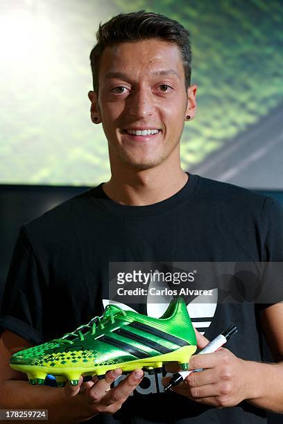 Real Madrid's German player Mesut Ozil is presented as the new face of Adidas at Estadio Santiago Bernabeu on August 28, 2013 in Madrid, Spain.