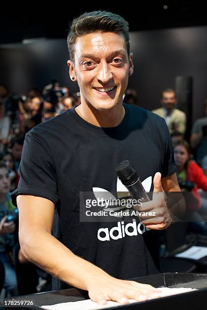 Real Madrid's German player Mesut Ozil is presented as the new face of Adidas at Estadio Santiago Bernabeu on August 28, 2013 in Madrid, Spain.