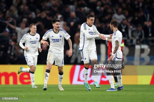 Mohamed Elyounoussi of FC Copenhagen celebrates with teammates Kevin Diks and Diogo Goncalves after scoring the team's first goal during the UEFA...